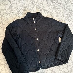 Black cropped quilted jacket model off duty aesthetic minimal chic